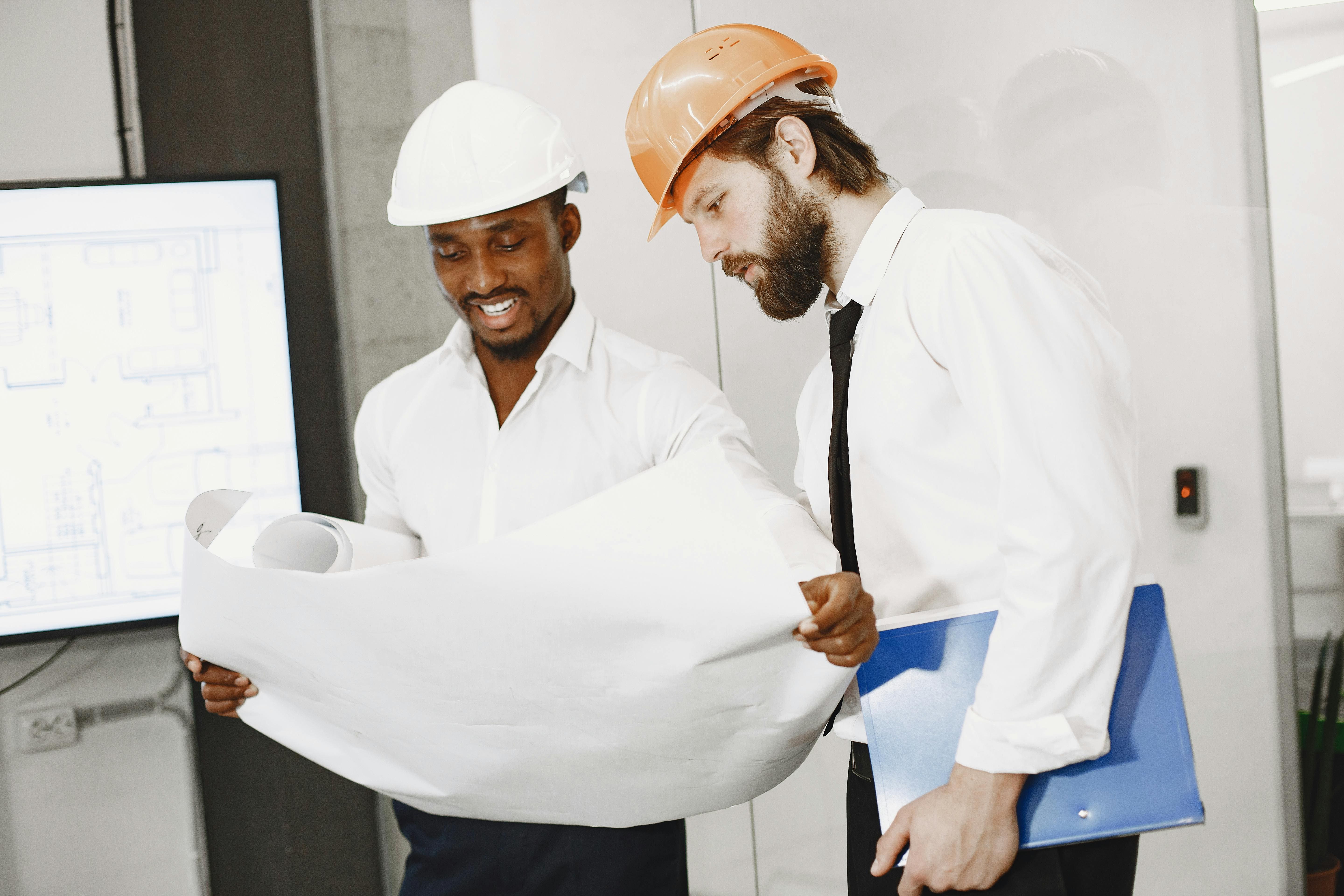 Engineer holding blueprints